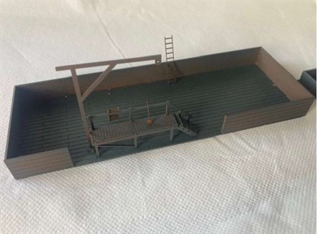 Kulgård med askekasse og kran